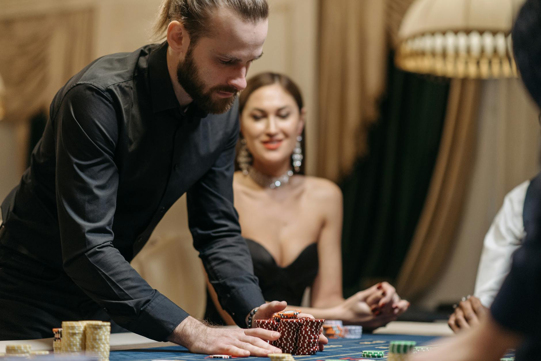 a man betting casino chips