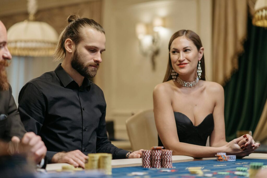 a man and woman playing in the casino