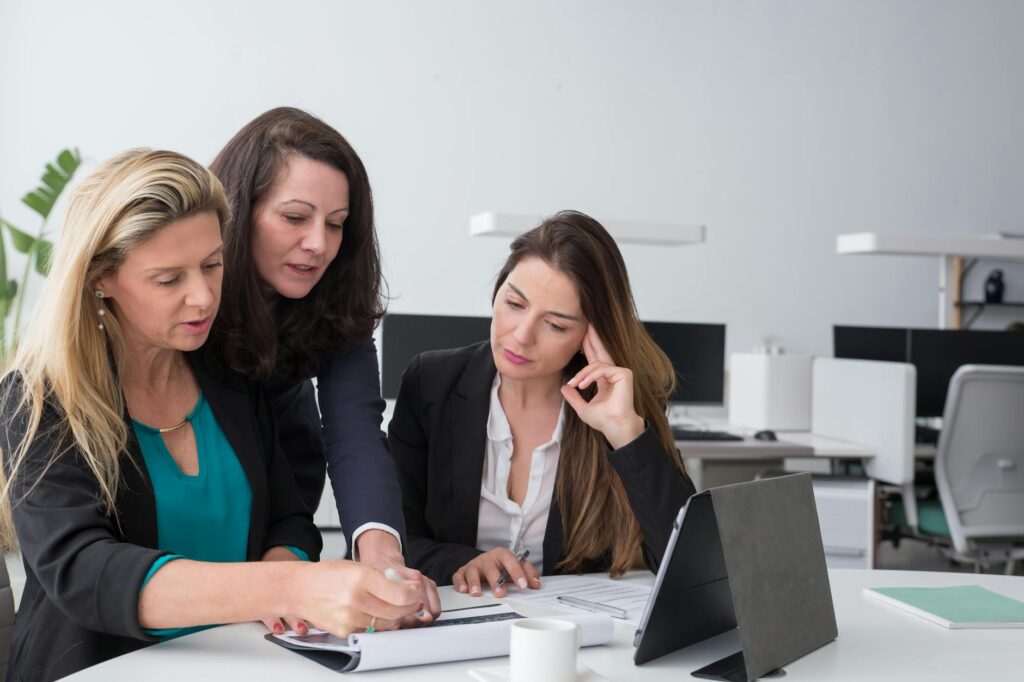 group of businesswomen preparing a schedule