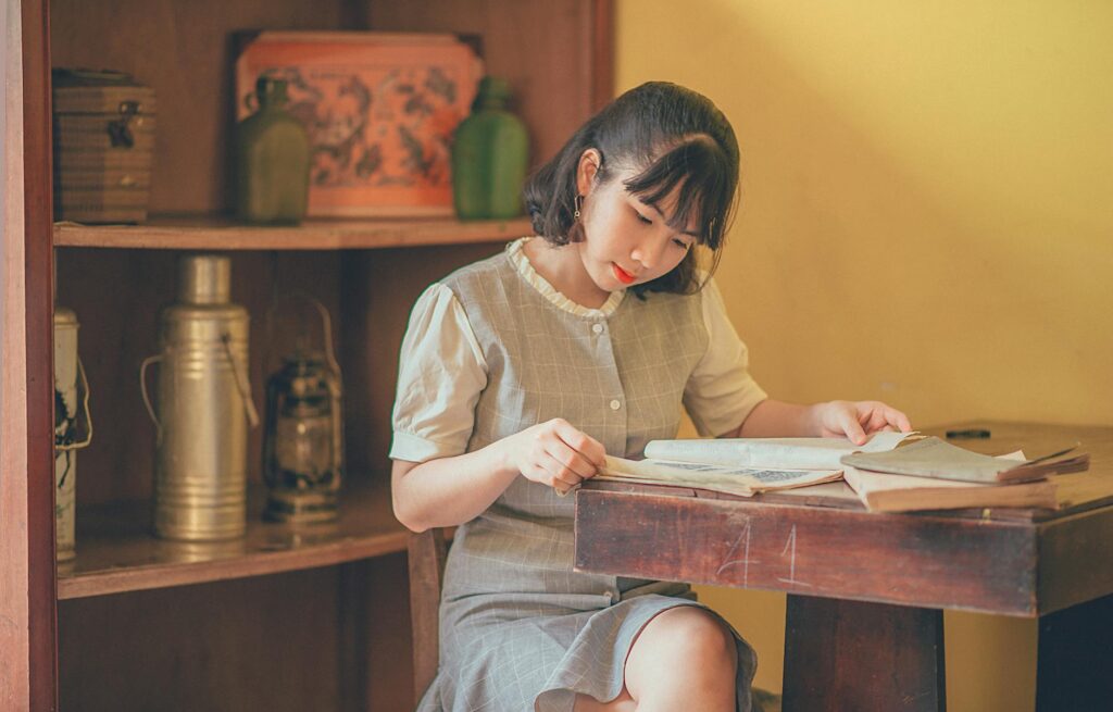 photo of short haired woman reading