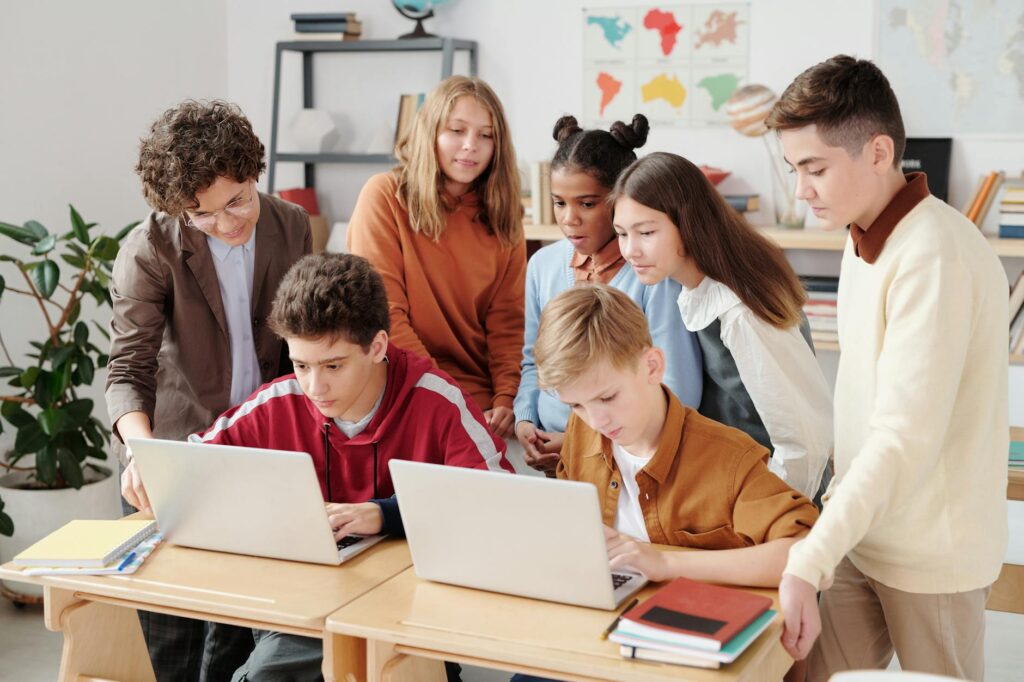 a children looking the laptop