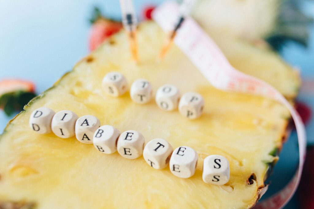 letter dices over a cut pineapple fruit